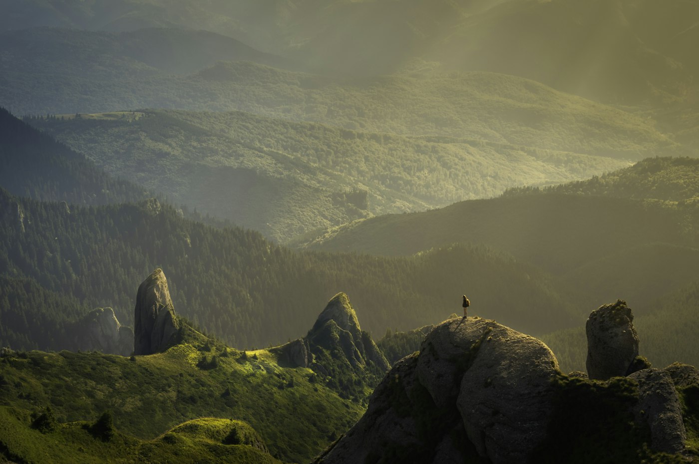 Sunlit mountain valley cinematic aerial