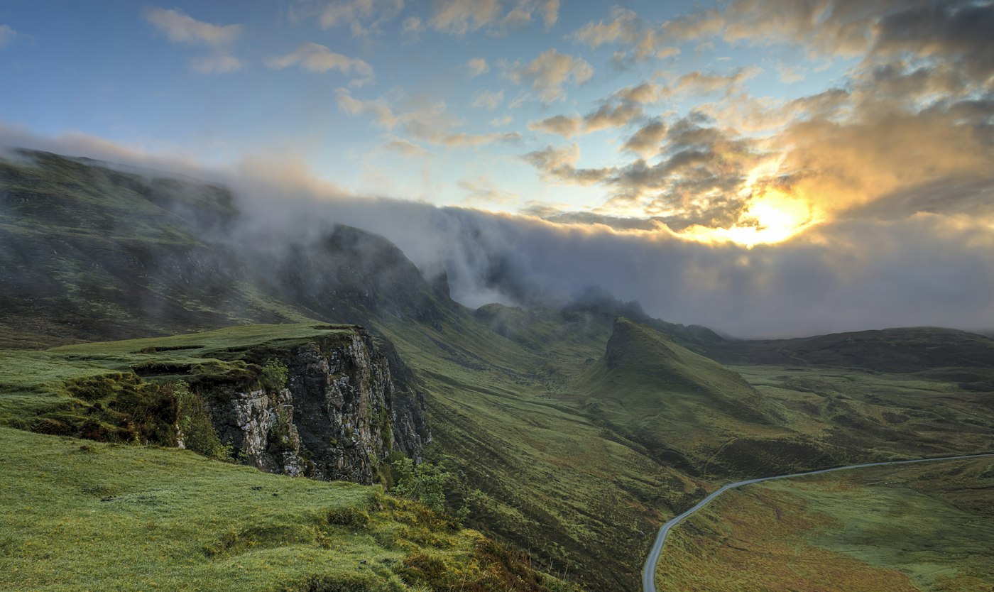 Foggy forested ridges at sunrise