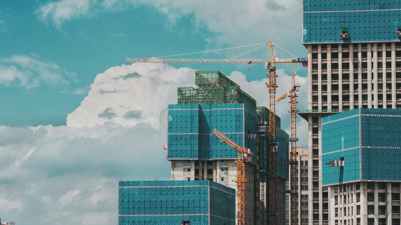 Tower cranes over high-rise construction