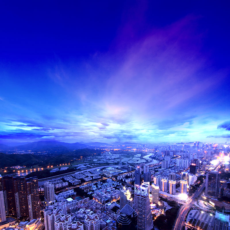 Aerial city skyline at dusk captured by drone